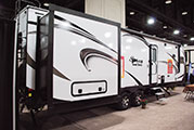 2018 KZ RV Spree S302FKF Travel Trailer Exterior Rear 3-4 Door Side