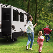 2019 KZ RV Durango D333RLT Fifth Wheel with Family Playing Outdoors