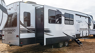 2019 KZ RV Durango D343MBQ Fifth Wheel Exterior Rear 3-4 Door Side with Slide Out