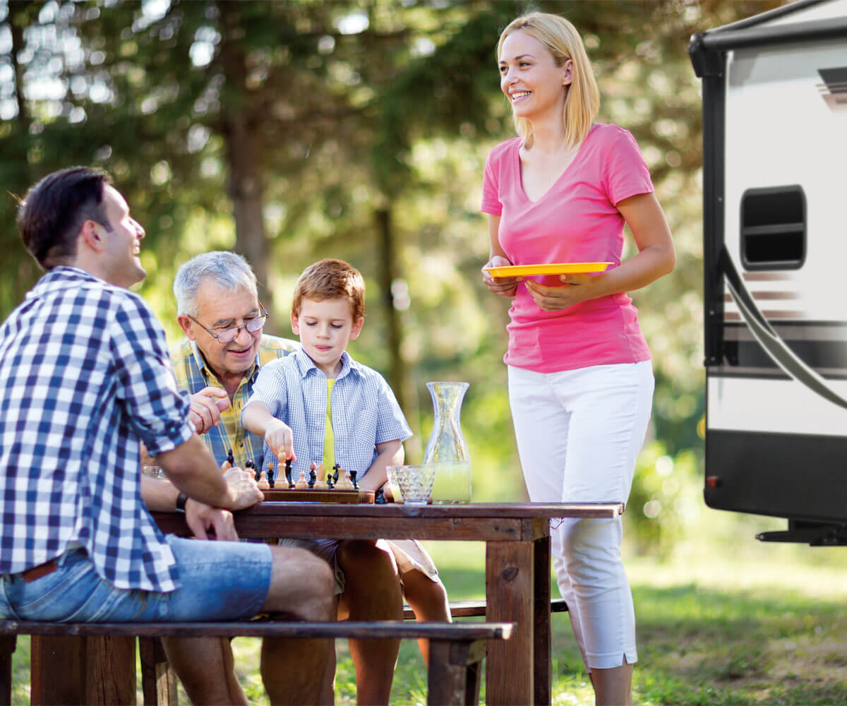 2019 Durango Half-Ton Lightweight Luxury Fifth Wheel with Family at Outdoor Picnic