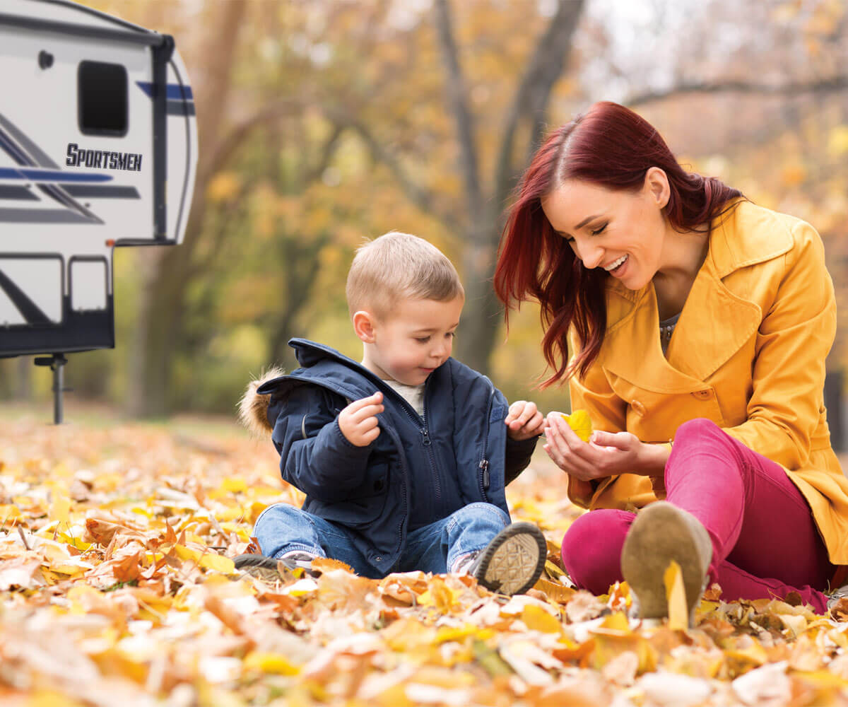 2019 Sportsmen Fifth Wheel with Mother and Son Exploring Fall Leaves