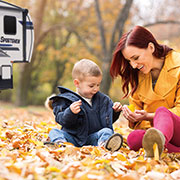 2019 KZ RV Sportsmen 303RL Fifth Wheel with Mother and Son Exploring Fall Leaves