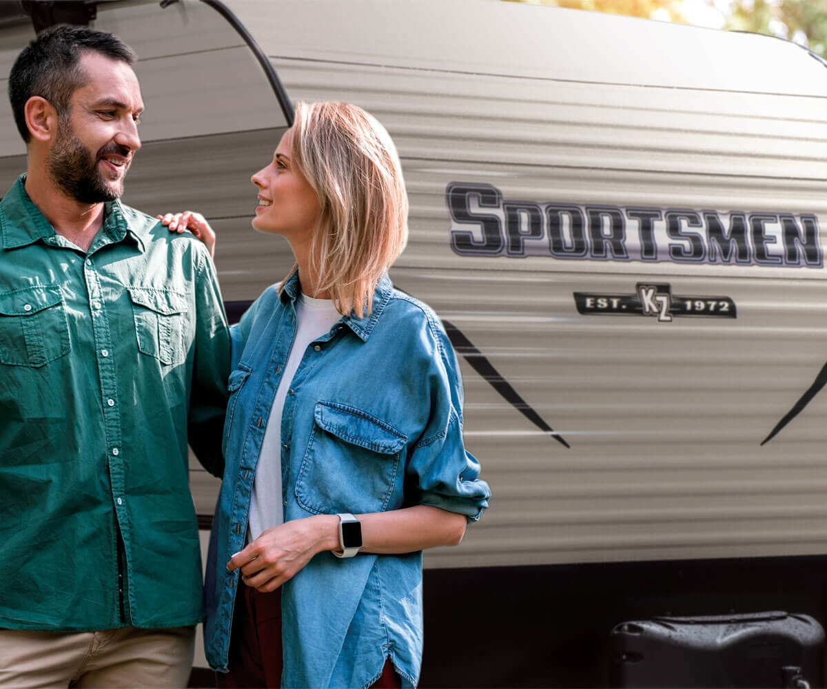 2019 Sportsmen SE Travel Trailer with Couple Hiking Outdoors