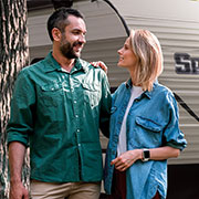 2019 KZ RV Sportsmen SE 230BHSE Travel Trailer with Couple Hiking Outdoors