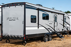 2019 KZ RV Sportster 301THR Travel Trailer Toy Hauler Exterior Rear 3-4 Door Side