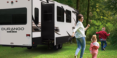 2019 KZ RV Durango D333RLT Fifth Wheel with Family Playing Outdoors