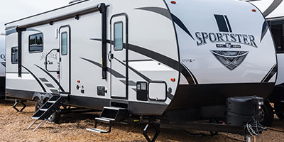 2019 KZ RV Sportster 301THR Travel Trailer Toy Hauler Exterior Front 3-4 Door Side