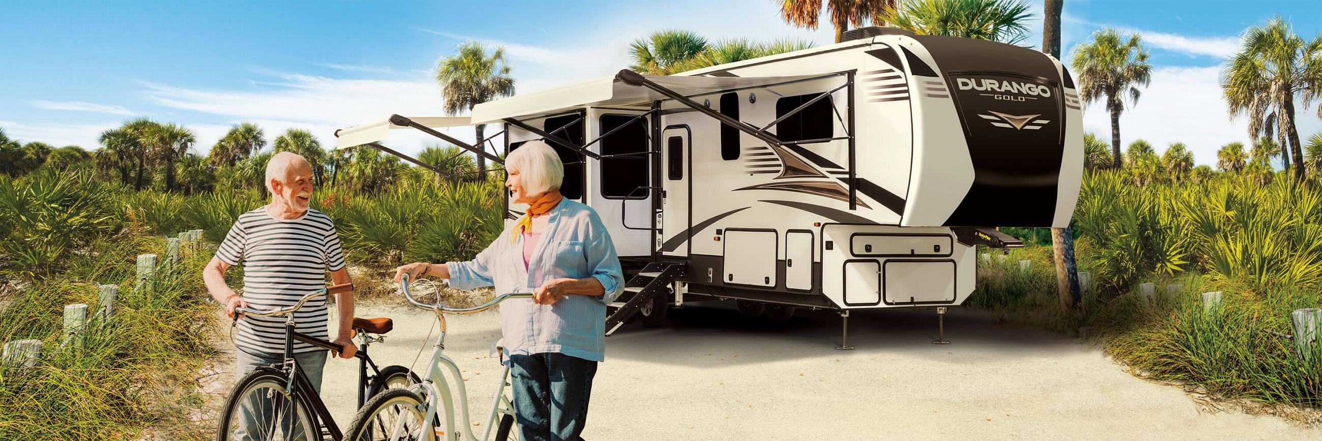 2021 KZ RV Durango Gold G356RLT Fifth Wheel with Couple at Campsite