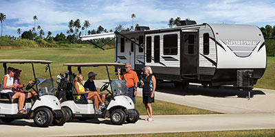 2023 KZ RV Sportsmen 364BH Destination Travel Trailer with Golfers at Golf Course