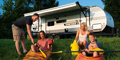 2023 KZ RV Sportsmen SE 281BHSE Travel Trailer with Family Preparing to Kayak