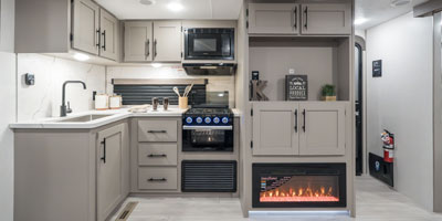 2025 KZ RV Connect SE C221RBSE Travel Trailer Kitchen and Entertainment Center Straight On with Microwave and Stove