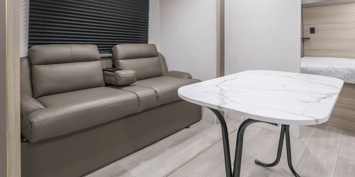 2025 KZ RV Sportsmen Select 221RKSL Travel Trailer Sofa Folding Table