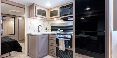 2025 KZ RV Sportsmen SE 292RBKSE Travel Trailer Kitchen and Bedroom