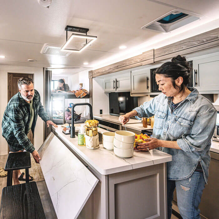 2026 KZ RV Connect C252BH Travel Trailer with Family in Kitchen