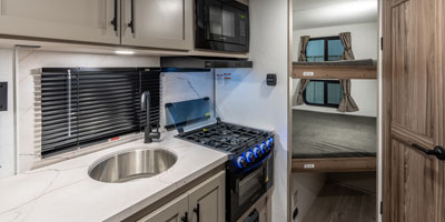 2026 KZ RV Connect Mini CM231BH Travel Trailer Kitchen Detail Deep Bowl Sink, Microwave and Cooktop