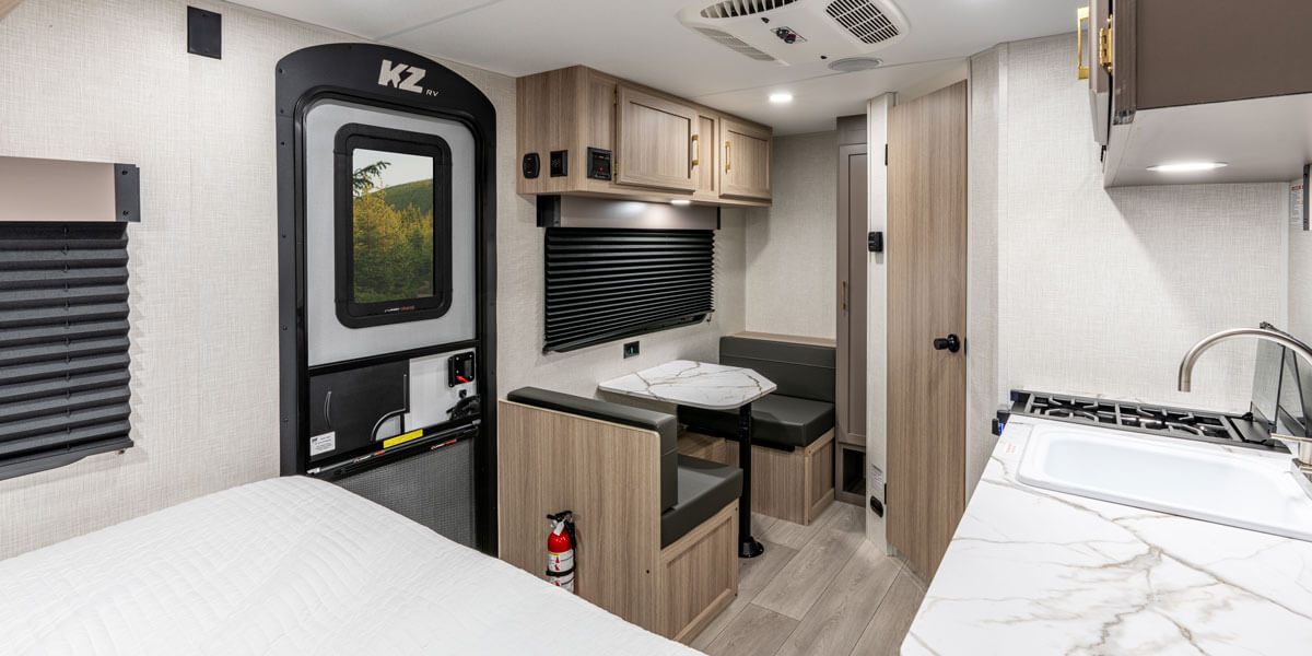 2026 KZ RV Sportsmen Classic 130RD Travel Trailer Dinette and Living Room