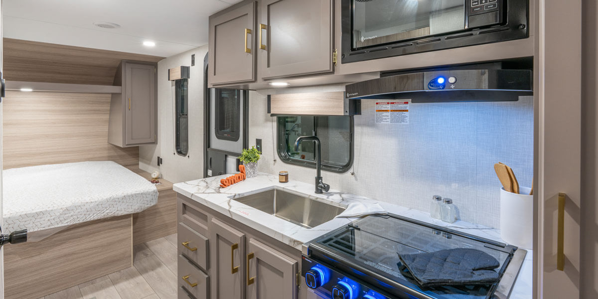 2026 KZ RV Sportsmen Select 210RDSL Travel Trailer Kitchen Stovetop, Microwave and Sink