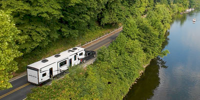 2026 KZ RV Sportster X 3411X Fifth Wheel Toy Hauler Exterior Lifestyle Driving 03