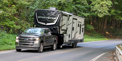 2026 KZ RV Sportster X 3411X Fifth Wheel Toy Hauler Exterior Lifestyle Driving 04