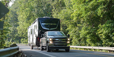 2026 KZ RV Sportster X 3411X Fifth Wheel Toy Hauler Exterior Lifestyle Driving 06