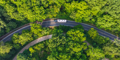 2026 KZ RV Sportster X 3411X Fifth Wheel Toy Hauler Exterior Lifestyle Driving 08