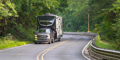 2026 KZ RV Sportster X 3411X Fifth Wheel Toy Hauler Exterior Lifestyle Driving 09